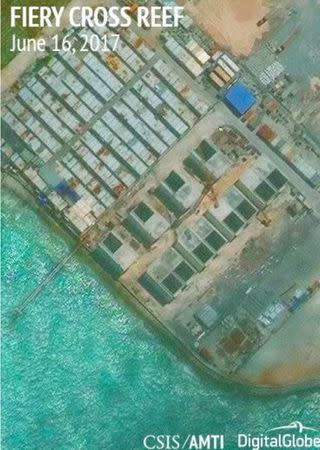 Construction is shown on Fiery Cross Reef, in the Spratly Islands, the disputed South China Sea in this June 16, 2017 satellite image released by CSIS Asia Maritime Transparency Initiative at the Center for Strategic and International Studies (CSIS) to Reuters on June 29, 2017. MANDATORY CREDIT CSIS/AMTI DigitalGlobe/Handout via REUTERS