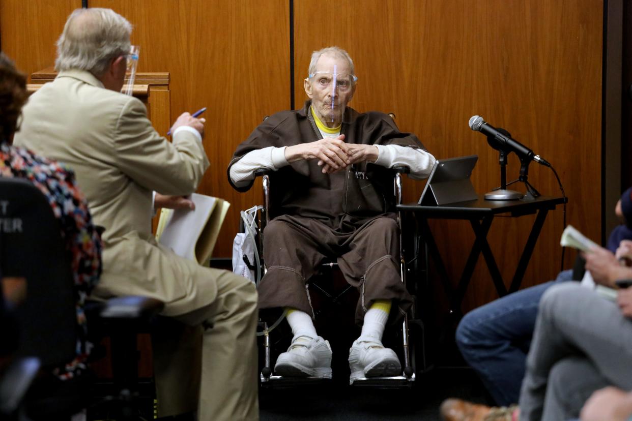 Robert Durst, 78, New York real estate scion, answers questions from defense attorney Dick DeGuerin, left, on Aug. 9 during his murder trial in California.