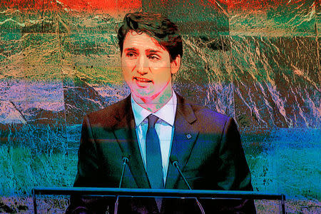 A television screen shows Canadian Prime Minister, Justin Trudeau, as he addresses the 72nd United Nations General Assembly at U.N. headquarters in New York, U.S., September 21, 2017. REUTERS/Lucas Jackson