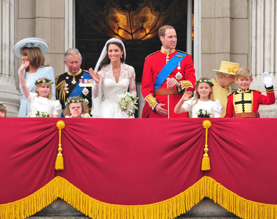 Charles looks on as Prince William and Kate Middleton wave from the Buckingham Palace balcony following their 2011 wedding. (Getty Images)