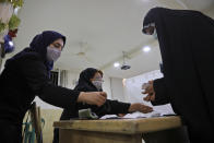 Election officials count ballots for the presidential elections at a polling station in Tehran, Iran, early Saturday, June 19, 2021. Iranians voted Friday in a presidential election dominated by Supreme Leader Ayatollah Ali Khamenei's hard-line protege after the disqualification of his strongest competition, fueling apathy that left some polling places largely deserted despite pleas to support the Islamic Republic at the ballot box. (AP Photo/Vahid Salemi)