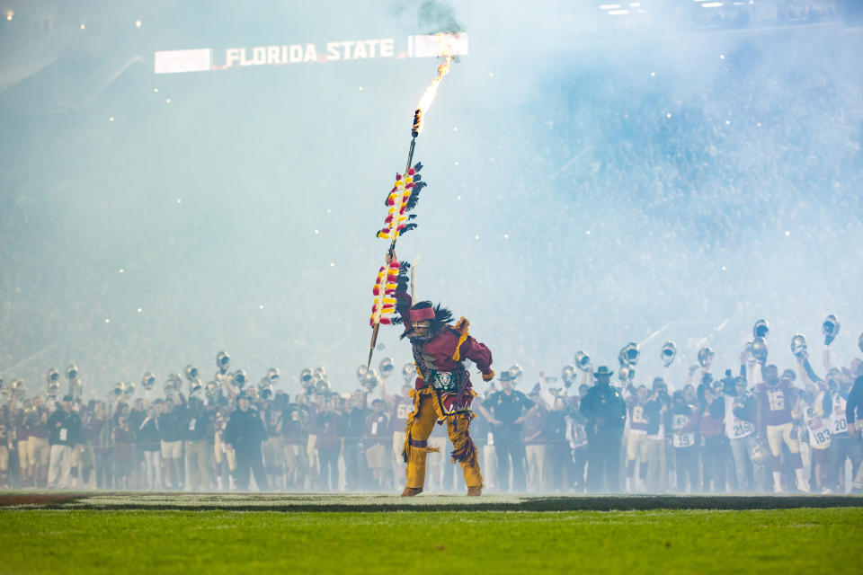 Osceola raises the spear for the crowd before he plants it a midfield for the NCAA football game between the Florida State Seminoles and the Florida Gators. (Getty Images)