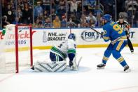 Apr 6, 2019; St. Louis, MO, USA; St. Louis Blues center Ryan O'Reilly (90) scores a goal during the overtime shootout of the NHL Western Division game against the Vancouver Canucks at Enterprise Center. Mandatory Credit: William Purnell-USA TODAY Sports