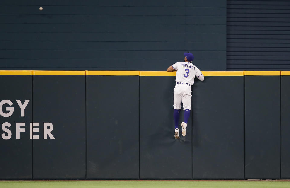 Texas Rangers center fielder Leody Taveras (3) watches as Chicago White Sox's Yasmani Grandal's home run sails over the outfield wall during the sixth inning of a baseball game, Saturday, Sept. 18, 2021, in Arlington, Texas. (AP Photo/Brandon Wade)