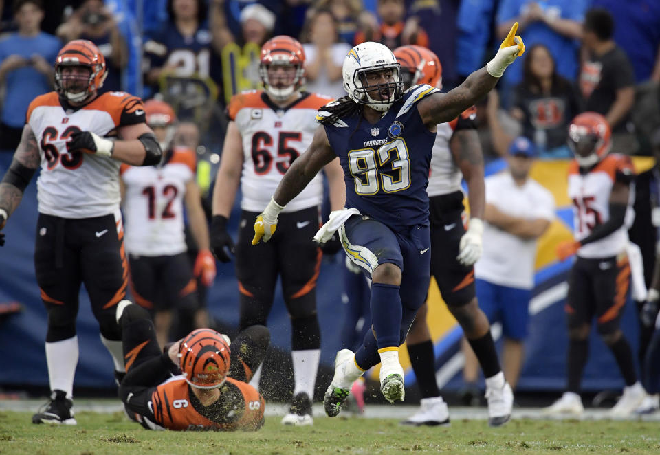 <p>Los Angeles Chargers defensive tackle Darius Philon (93) celebrates after sacking Cincinnati Bengals quarterback Jeff Driskel, bottom left, on a two-point conversion attempt late in the fourth quarter during an NFL football game Sunday, Dec. 9, 2018, in Carson, Calif. (AP Photo/Mark J. Terrill) </p>