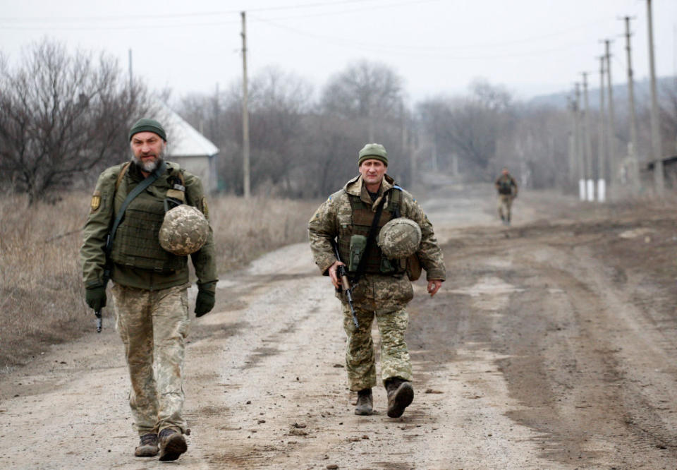 Ukrainian servicemen patrol in the settlement of Troitske in the Lugansk region near the front line with Russia-backed separatists.