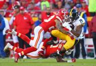 Oct 15, 2017; Kansas City, MO, USA; Pittsburgh Steelers wide receiver JuJu Smith-Schuster (19) is tackled by Kansas City Chiefs cornerback Phillip Gaines (23) and linebacker Kevin Pierre-Louis (57) in the second half at Arrowhead Stadium. Mandatory Credit: Jay Biggerstaff-USA TODAY Sports