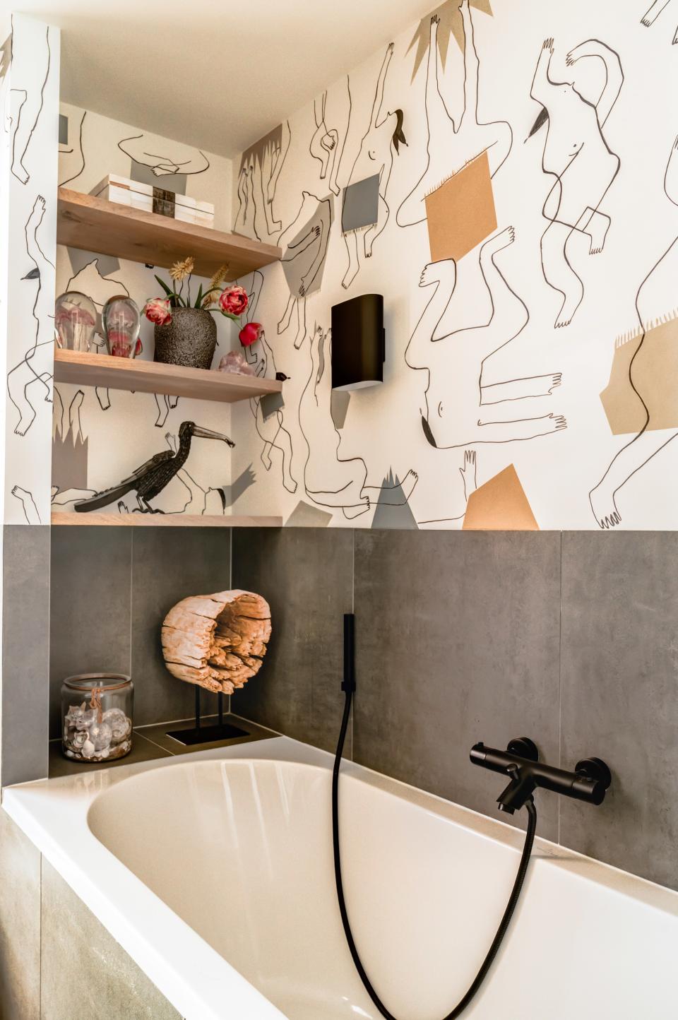 The bathroom had been renovated when Madelon moved in, but she found it “boring and plain and definitely not unique.” She enlarged a wallpaper pattern by Pierre Frey on the walls to fix the problem.