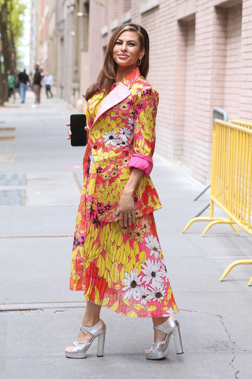 Eva Mendes Wears A Colorful Yellow Dress And Silver Platform High Heels At The View In New York City. - Credit: Christopher Peterson / SplashNews.com