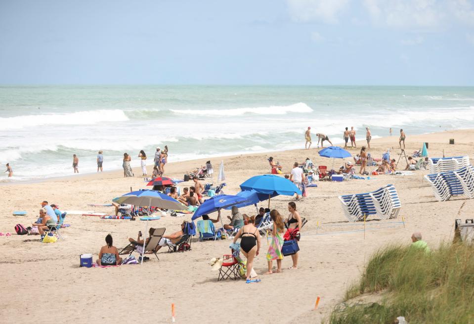 Beachgoers enjoy the sunny weather during Labor Day on Monday, Sept. 4, 2023, at Stuart Beach.