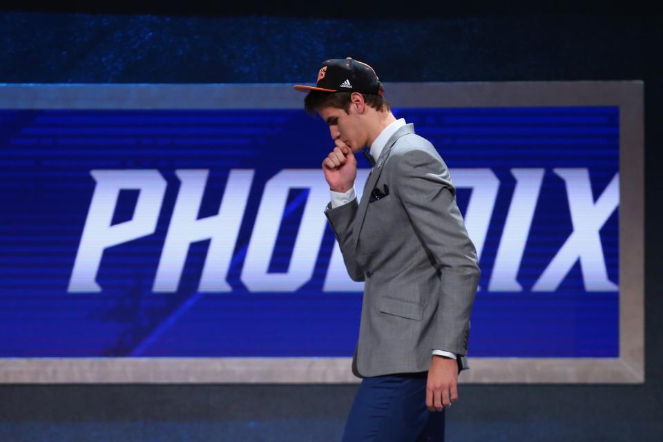 <p>NEW YORK, NY – JUNE 23: Dragan Bender kisses his necklace on stage after being drafted fourth overall by the Phoenix Suns in the first round of the 2016 NBA Draft at the Barclays Center on June 23, 2016 in the Brooklyn borough of New York City. (Photo by Mike Stobe/Getty Images) </p>