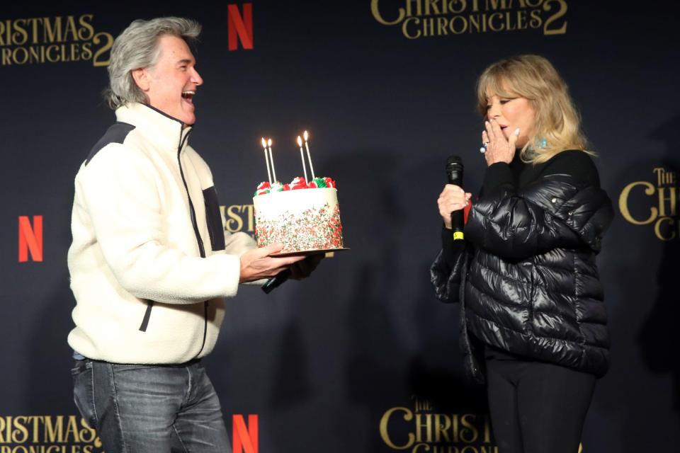 <p>Kurt Russell presents longtime love Goldie Hawn a birthday cake, ahead of her 75th birthday, at Netflix's <em>The Christmas Chronicle: Part Two</em> drive-in event at The Grove on Thursday in L.A.</p>