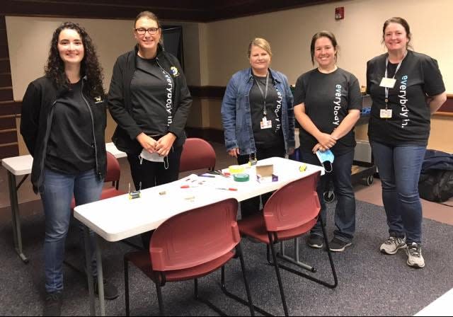 The workshop “Electric Cars in Your Future" was presented by Sandy Calabrese, manager of the General Motors Brownstown Battery Plant, and her team (shown here).
Each student created her own electric “engine” using a D cell battery and a paper clip.