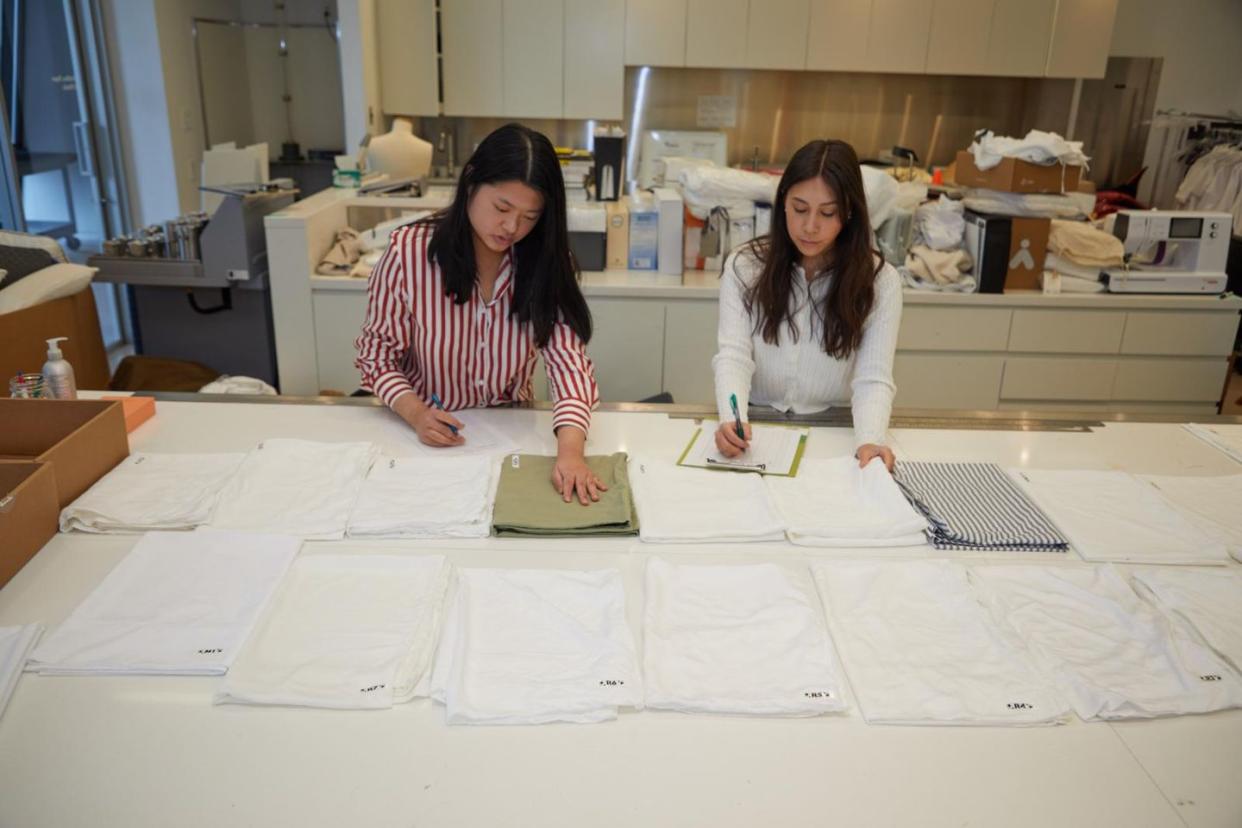 two women in the lab testing sheet softness