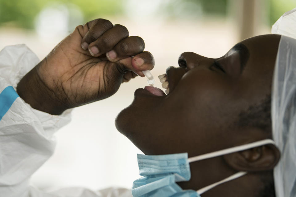 A health worker takes a cholera vaccine at the Bwaila Hospital in Lilongwe central Malawi Wednesday, Jan. 11, 2023. Malawi’s health minister says the country’s worst cholera outbreak in two decades has killed 750 people so far. The southern African country of 20 million people first reported the outbreak in March last year. (AP Photo/Thoko Chikondi)