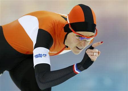 Irene Wust of the Netherlands skates during the women's 3,000 metres speed skating race at the Adler Arena during the 2014 Sochi Winter Olympics February 9, 2014. REUTERS/Marko Djurica