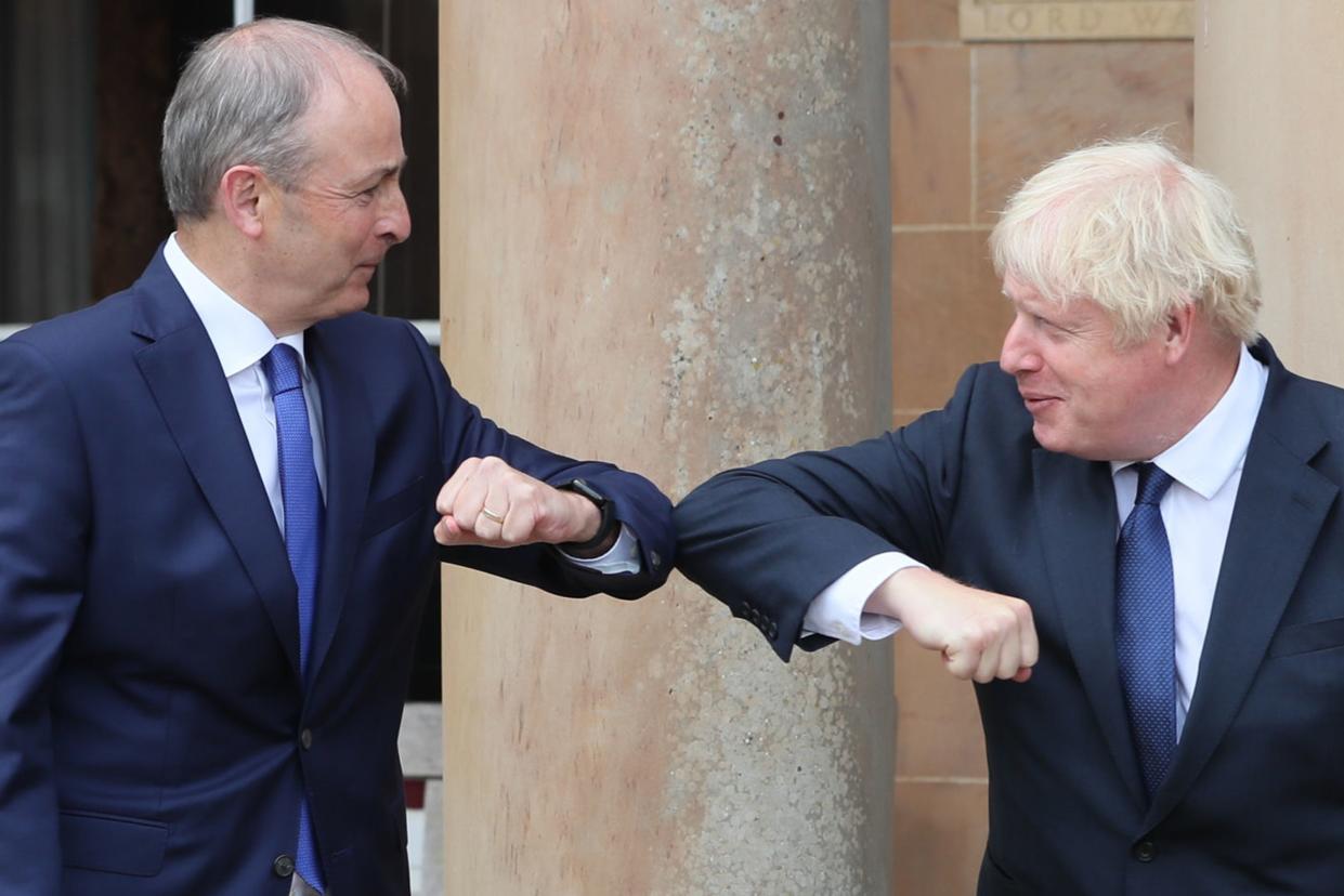 Boris Johnson (right) and Taoiseach Micheal Martin during an earlier visit to Belfast in August  (Getty Images)