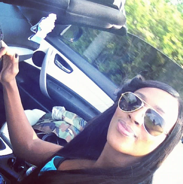 Celebrity photos: Alexandra Burke made the most of the hot weather this week by going for a drive with her roof down. Oh we are so envious.