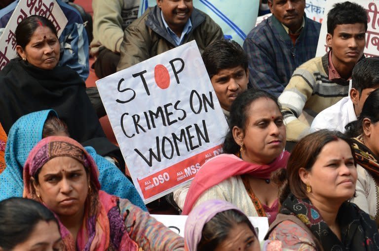 A protester holds a sign during a rally against the the gang-rape and murder of a student in India on January 16, 2013. The brutal gang-rape and murder of the 23-year-old student on a bus in New Delhi on December 16 sparked shockwaves and protests across the nation