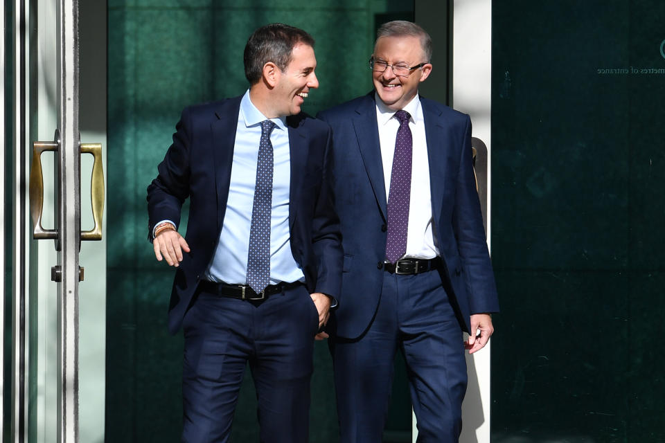 Opposition Leader Anthony Albanese (r) and Shadow Treasurer Jim Chalmers exit Parliament House smiling.