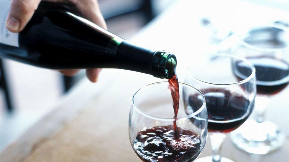 PHOTO: A person is pictured pouring red wine. (Joe Vaughn/Getty Images)