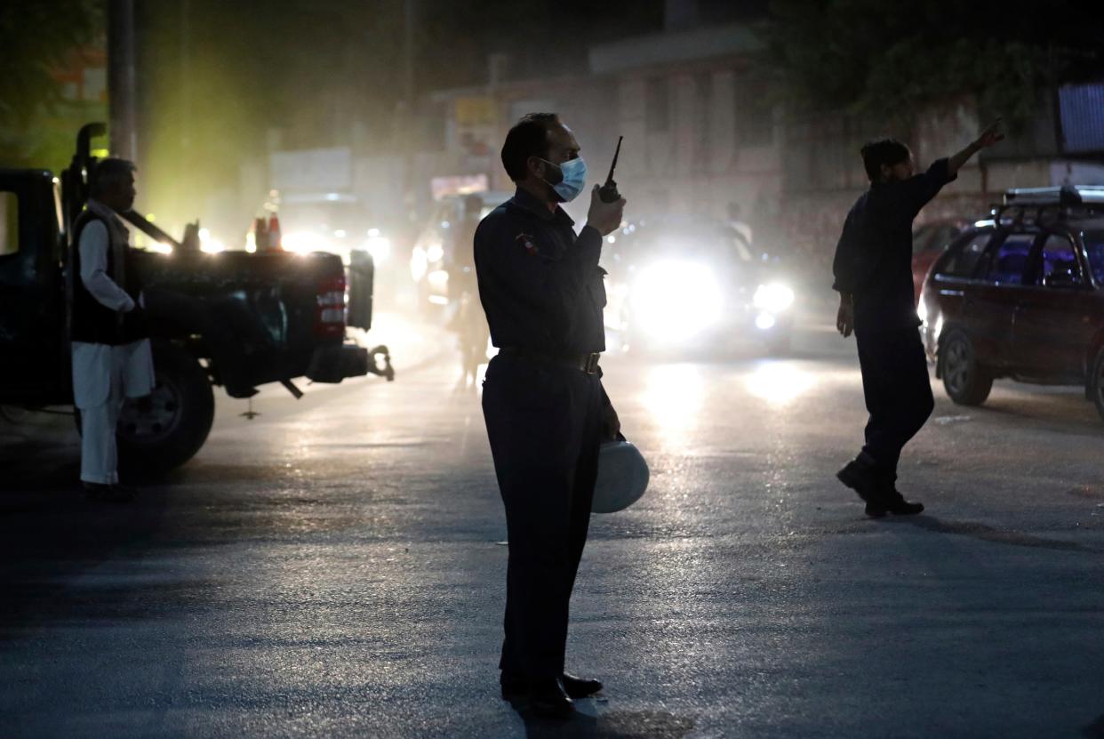 Afghan security personnel work at the site of Tuesday’s powerful explosion in Kabul (AP)