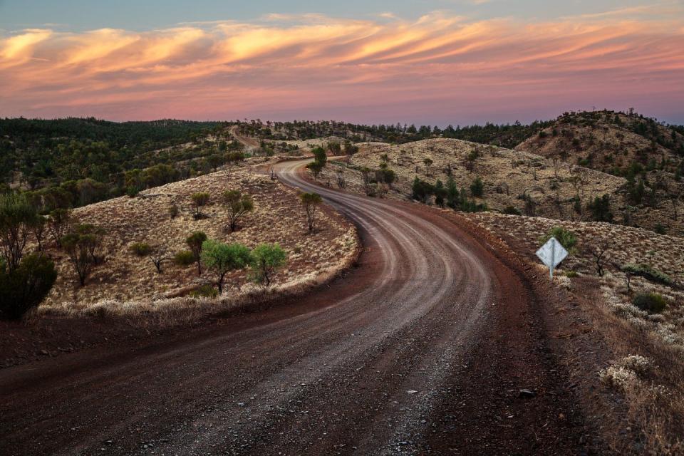 <p>A winding dirt road leads to Razorback Lookout in Southern Australia.</p>