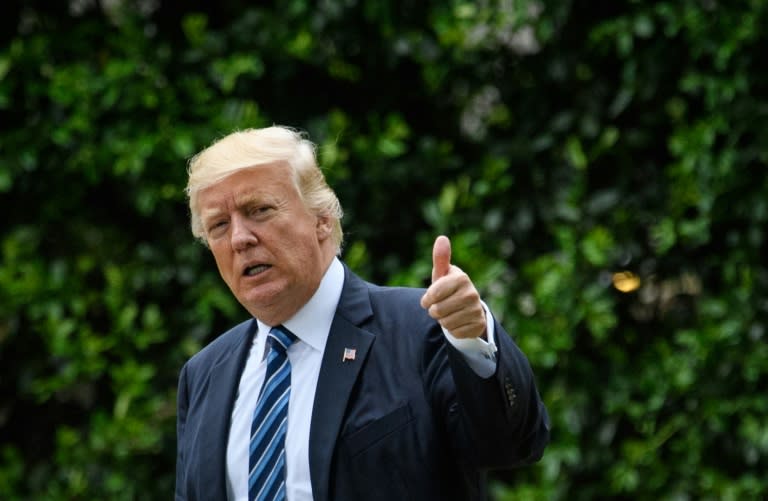 President Donald Trump, pictured here at the White House on Friday, says he looks "very much forward" to working with France's president-elect Emmanuel Macron