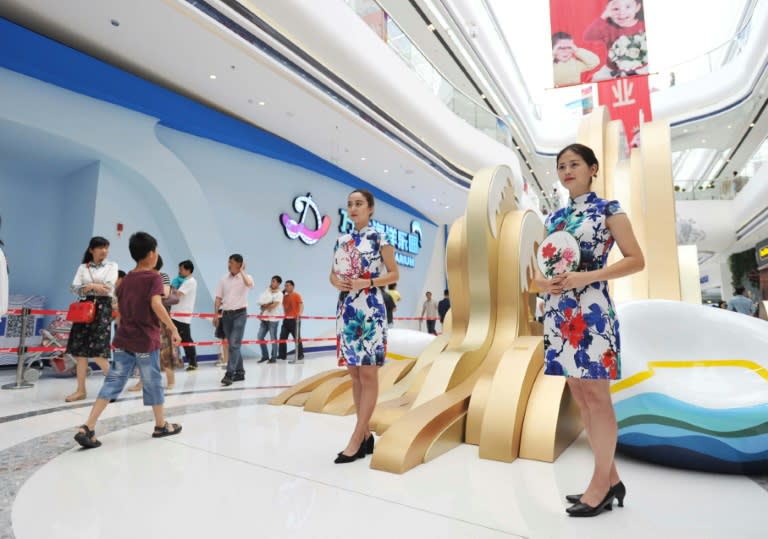 People visit the newly open theme park "Wanda City" in Nanchang, east China's Jiangxi province, in May 2016