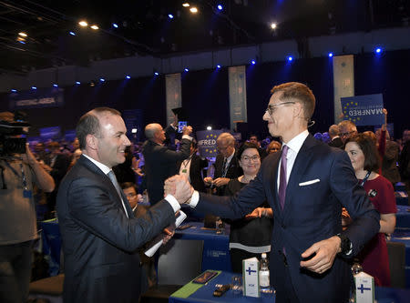 The candidates to lead EPP, Manfred Weber of Germany and Alexander Stubb of Finland greet each other after their speeches at the European People's Party (EPP) congress in Helsinki, November 8, 2018. Lehtikuva/Markku Ulander via REUTERS