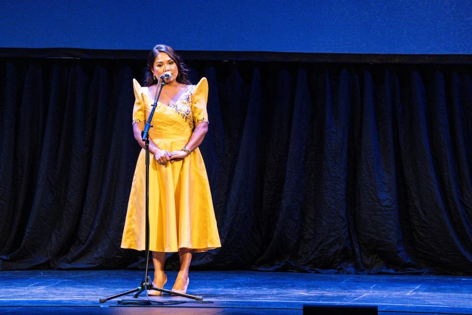 Luisita McBurney tells a story during the Des Moines Register Storytellers Project's "Family" show at Hoyt Sherman Place on Tuesday, October 24, 2023 in Des Moines.