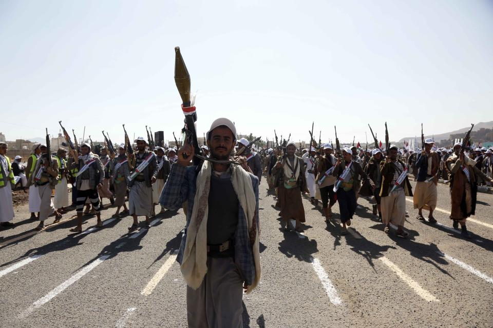 Thousands of Houthi graduates who completed their military training, attend a military parade with their light and heavy weapons in Amran, Yemen on Dec. 20, 2023.