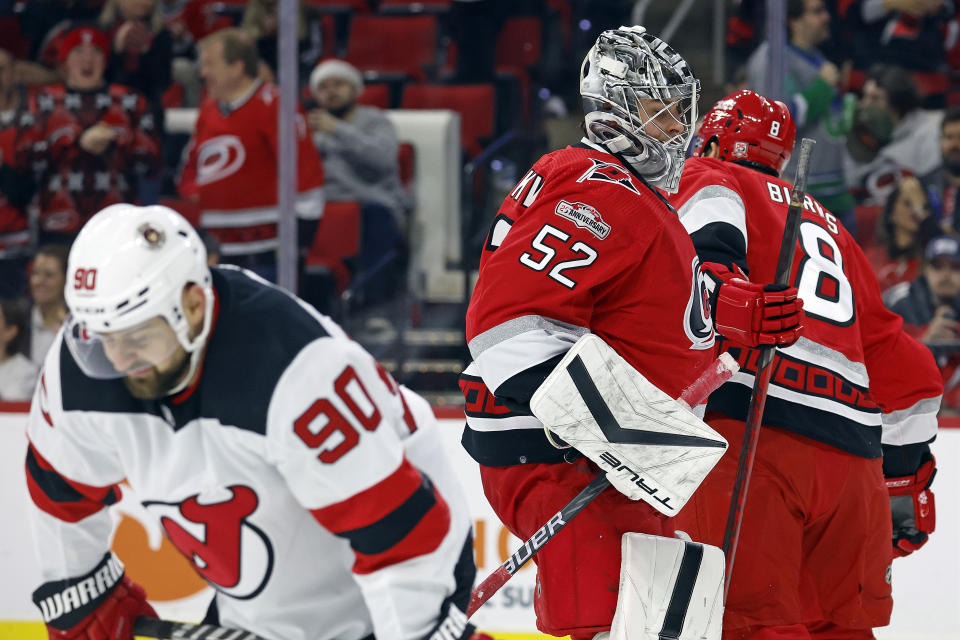 Carolina Hurricanes goaltender Pyotr Kochetkov (52) skates back to the net after surviving a barrage of shots by the New Jersey Devils during the first period of an NHL hockey game in Raleigh, N.C., Tuesday, Dec. 20, 2022. (AP Photo/Karl B DeBlaker)