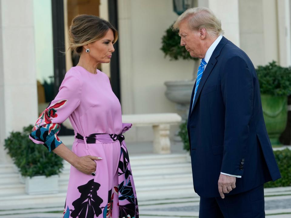 Melania Trump stands next to her husband donald trump