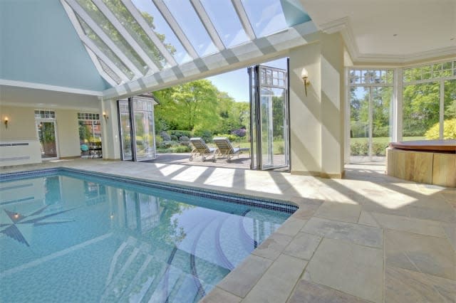 The swimming pool with glass roof