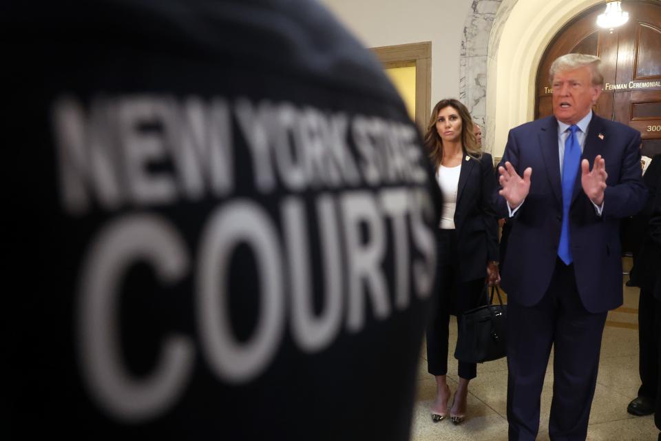 Former President Donald Trump speaks to the media as he arrives at New York State Supreme Court to start the civil fraud trial against him on Oct. 2, 2023 in New York City. Former President Trump may be forced to sell off his properties after Justice Arthur Engoron canceled his business certificates and ruled that he committed fraud for years while building his real estate empire after being sued by Attorney General Letitia James, seeking $250 million in damages. The trial will determine how much he and his companies will be penalized for the fraud.
