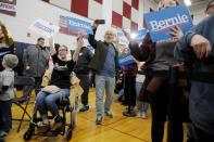 Supporters of U.S. Democratic presidential candidate Bernie Sanders listen to him speak during a rally in Dearborn, Michigan