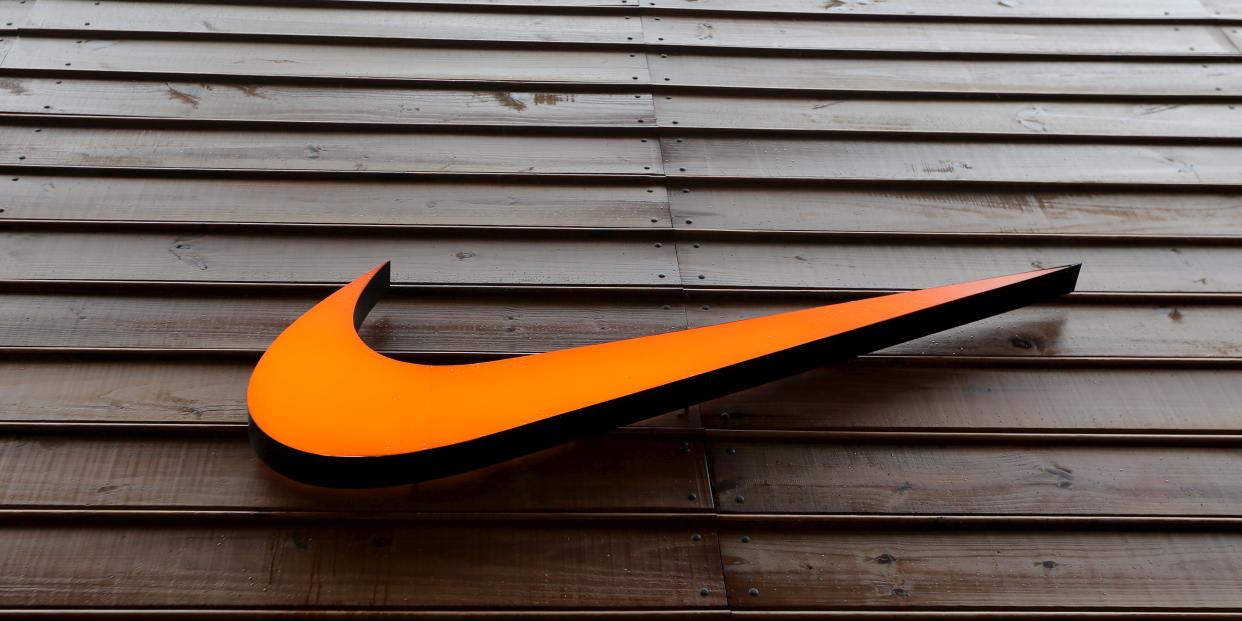 FILE PHOTO: The logo of Nike is seen in a storefront in Sao Paulo, Brazil, May 28, 2015. REUTERS/Paulo Whitaker/File Photo 