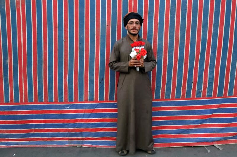 Yasir 'Idan, an Iraqi demonstrator, poses for a photograph during the ongoing anti-government protests in Baghdad