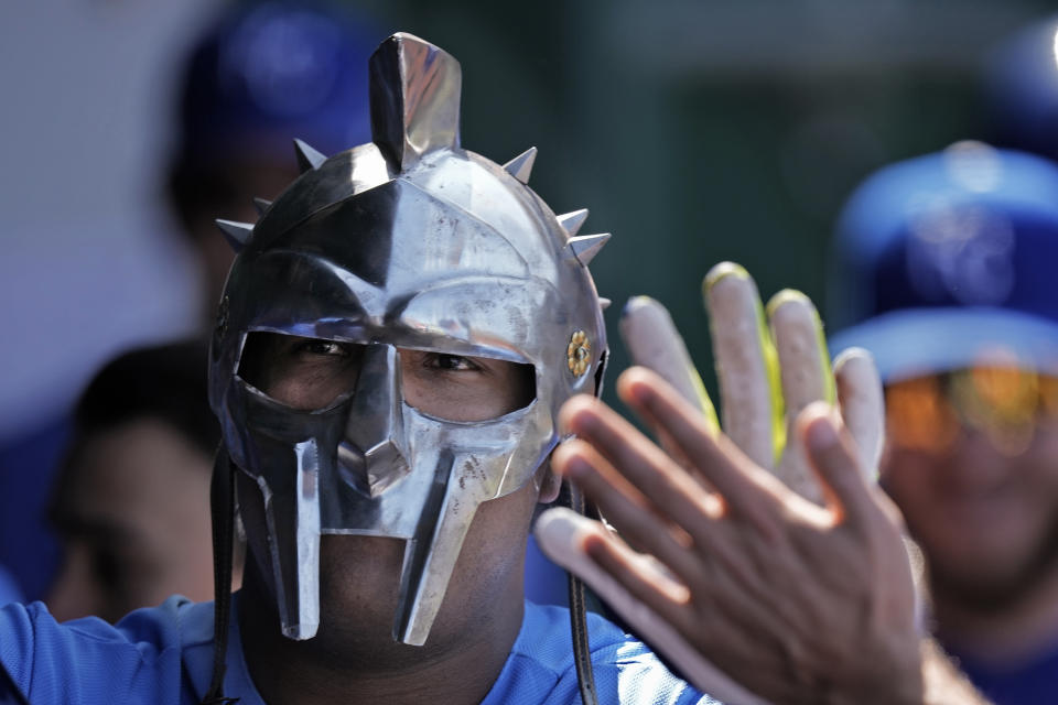 Kansas City Royals' Salvador Perez celebrates in the dugout after hitting a solo home run during the third inning of a baseball game against the Washington Nationals Saturday, May 27, 2023, in Kansas City, Mo. (AP Photo/Charlie Riedel)