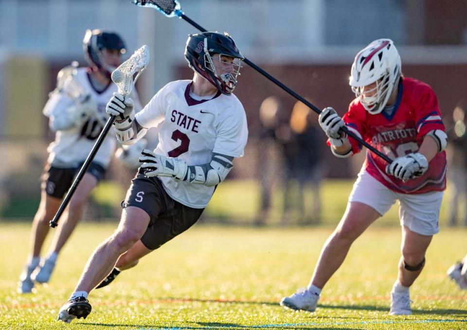 State College’s Ty Salazer cuts down the field with the ball around a Red Land defender during the game on Thursday, April 25, 2024. Abby Drey/adrey@centredaily.com