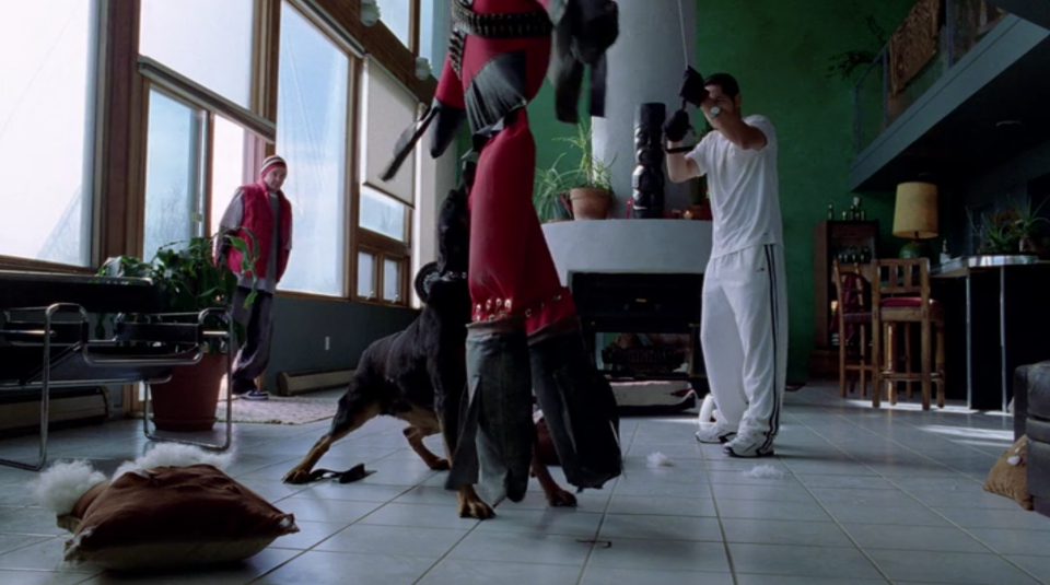 Jesse (Aaron Paul) pays Krazy-8 (Max Arciniega) and his attack dog a visit. (Screengrab: Netflix)