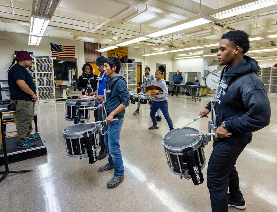 (Left) MPS traveling music teacher Jeremy Reyes runs through drills with Riverside University High School students as they prepare for the MPS Battle of the Drumlines competition on Wednesday November 29, 2023 in Milwaukee, Wis.
