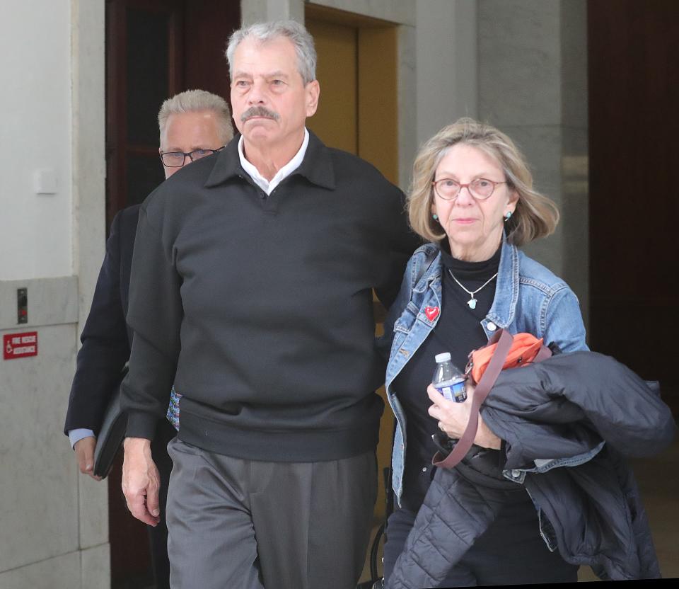 Former Public Utilities Chairman Sam Randazzo and his wife Carol Farmer leave Summit County Court after an arraignment hearing before Judge Susan Baker Ross on charges related to the FirstEnergy scandal on Tuesday, Feb. 13, 2024, in Akron, Ohio. [Phil Masturzo/ Beacon Journal]