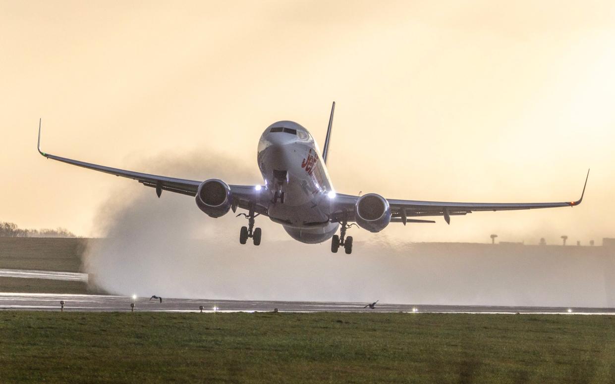 A Jet2 aircraft is blown sideways as it takes of in the strong winds & rain this morning from Leeds Bradford airport in Yorkshire