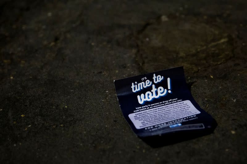 A voting flyer is seen on the ground at Philadelphia's City Hall, an early voting location for the upcoming presidential election, in Philadelphia, Pennsylvania