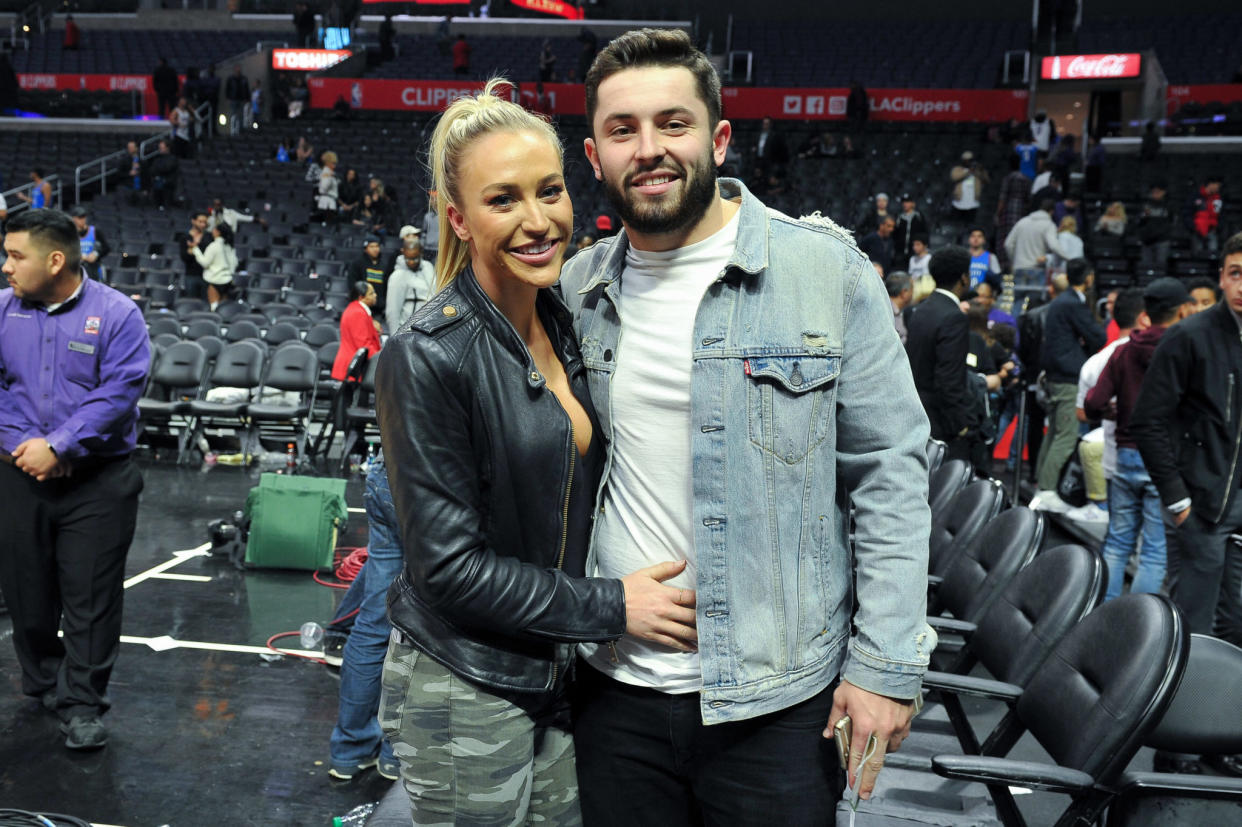 Baker Mayfield and his wife, Emily, on the court.