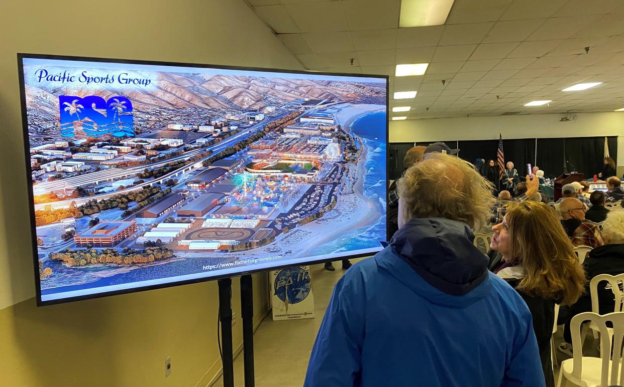 Audience members at a public hearing Wednesday study a proposed facelift of the Ventura County Fairgrounds.