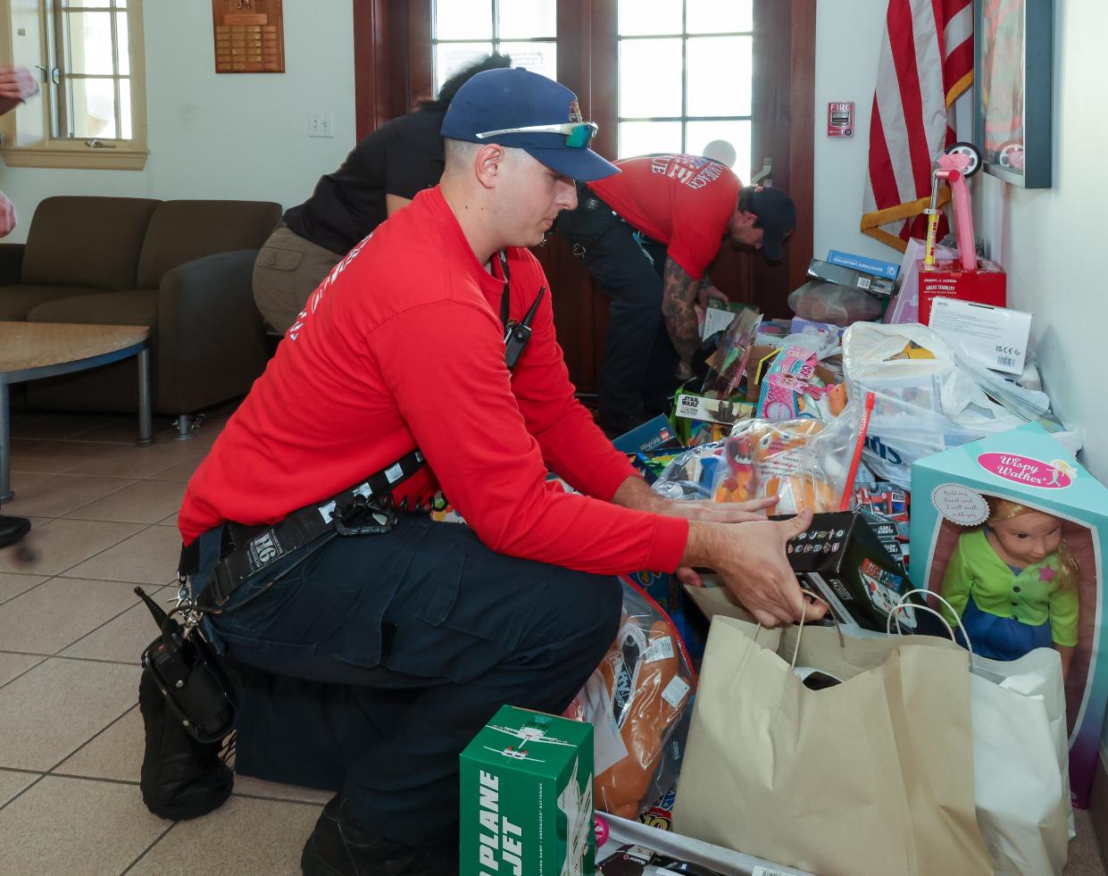 Palm Beach firefighter Nick Potenza prepares to carry toys collected last year out of Fire-Rescue Station No. 1.