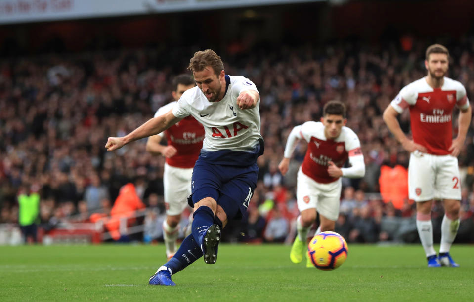 Tottenham Hotspur’s Harry Kane (centre) scores his side’s second goal from a controversial penalty